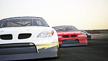 Three race cars racing