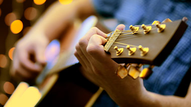playing acoustic guitar