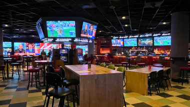 Interior of The Sportsbook with Tvs and Bar and seats