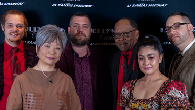 Group of 6 People in front of a Hollywood Background
