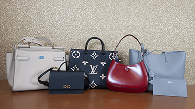 5 purses on a table