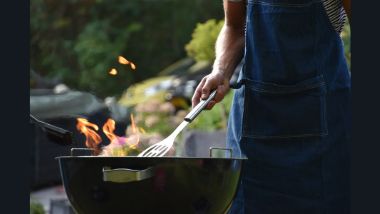 Someone BBQing on a grill